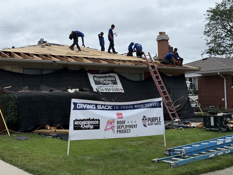Roofing project aiding veterans, showing teamwork and community support in home renovations.