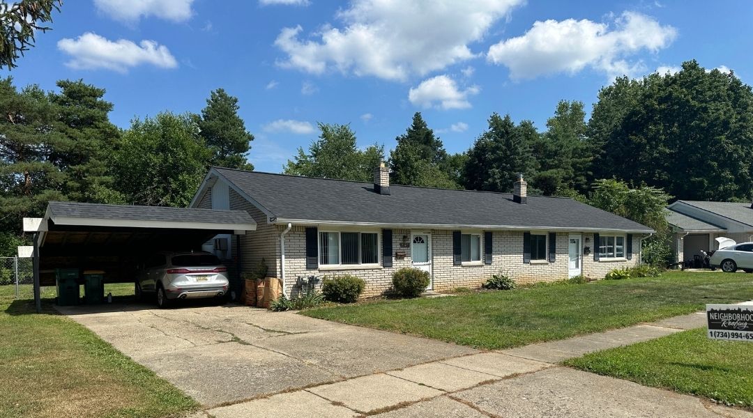 Charming single-story house in a serene neighborhood with modern roofing and lush landscaping.